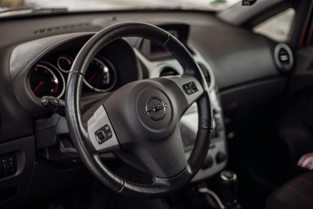 pexels-photo-10678139-10678139 Detailed close-up of Opel Corsa interior showcasing the steering wheel and dashboard.